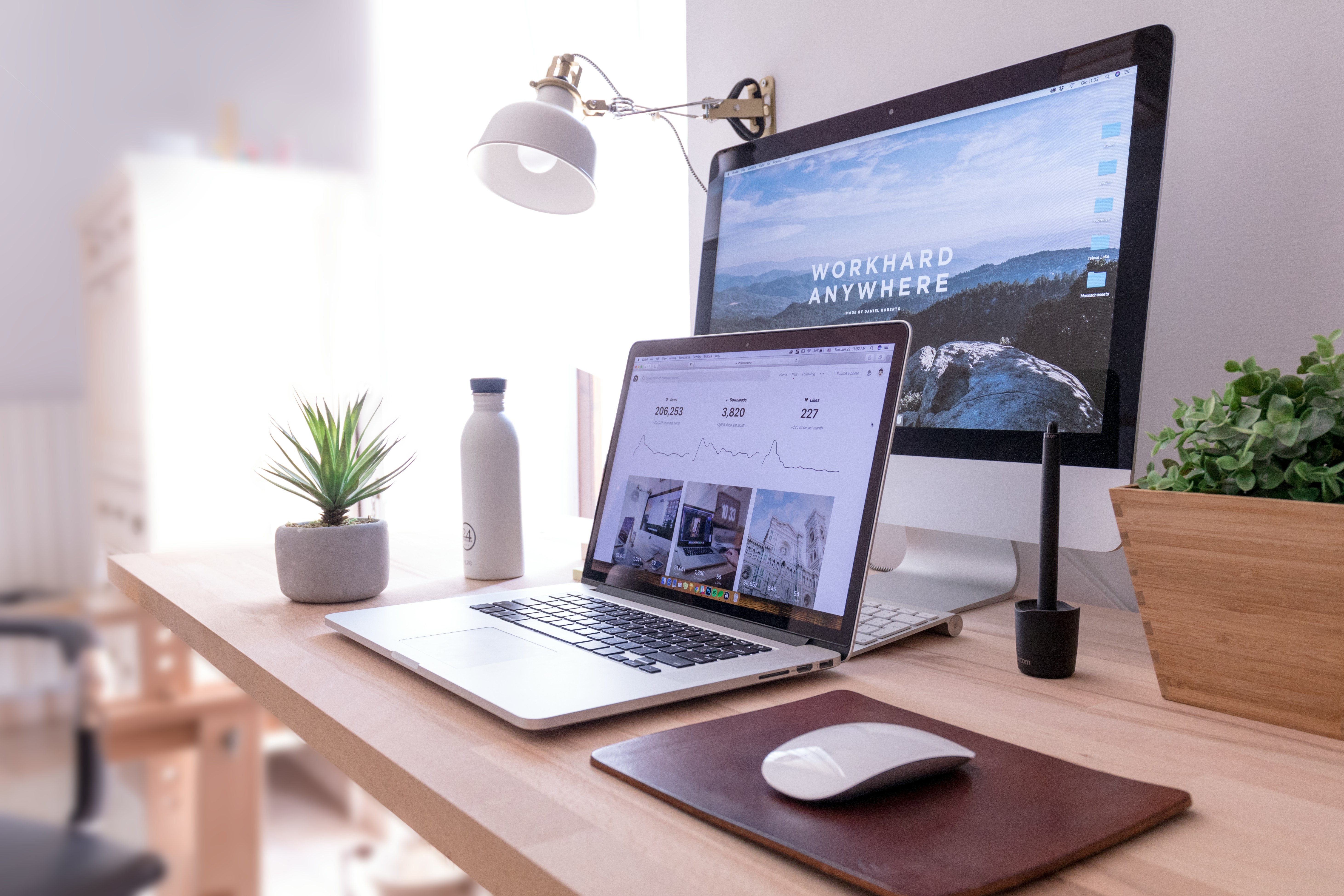 A home workspace with computers and connected equipment